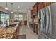 Modern kitchen with stainless steel appliances and granite counters at 143 Uruguay Dr, Punta Gorda, FL 33983