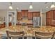 Kitchen island with granite countertop and seating for two at 143 Uruguay Dr, Punta Gorda, FL 33983