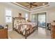 Spacious main bedroom with a king-size bed and private access to a patio at 143 Uruguay Dr, Punta Gorda, FL 33983