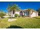 House exterior with palm trees and landscaping at 1434 Hedgewood Cir, North Port, FL 34288