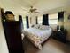 Main bedroom with king-size bed and window view at 1434 Viscaya Dr, Port Charlotte, FL 33952