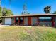 One story home with attached garage and manicured lawn at 1434 Viscaya Dr, Port Charlotte, FL 33952