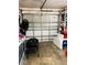Garage with folding table and storage shelving at 1434 Viscaya Dr, Port Charlotte, FL 33952