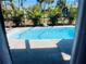 Inviting screened-in pool with tropical landscaping at 1434 Viscaya Dr, Port Charlotte, FL 33952