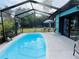 Inviting screened pool area, ready for relaxation at 1434 Viscaya Dr, Port Charlotte, FL 33952
