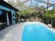 Relaxing screened pool area with patio furniture at 1434 Viscaya Dr, Port Charlotte, FL 33952