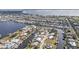Aerial view showing waterfront property and neighborhood at 162 Croop Se Ln, Port Charlotte, FL 33952