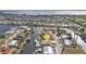 Bird's eye view of the home and surrounding waterfront community at 162 Croop Se Ln, Port Charlotte, FL 33952