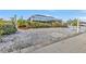 Landscaped backyard with a covered patio area at 162 Croop Se Ln, Port Charlotte, FL 33952
