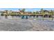 Spacious backyard with a brick walkway to the dock at 162 Croop Se Ln, Port Charlotte, FL 33952