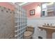 Bathroom with a glass block shower and pedestal sink at 162 Croop Se Ln, Port Charlotte, FL 33952