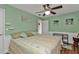 Bedroom with a king-size bed, ceiling fan, and wood flooring at 162 Croop Se Ln, Port Charlotte, FL 33952