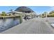 Covered boat lift and spacious dock at 162 Croop Se Ln, Port Charlotte, FL 33952