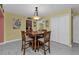 Bright dining room featuring a square table and four chairs at 162 Croop Se Ln, Port Charlotte, FL 33952