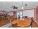 Round dining table with rattan chairs, opens to Gathering room at 162 Croop Se Ln, Port Charlotte, FL 33952