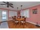 Dining area with wood table and rattan chairs near sliding doors at 162 Croop Se Ln, Port Charlotte, FL 33952