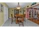 Casual dining area with hardwood floors and built-in hutch at 162 Croop Se Ln, Port Charlotte, FL 33952