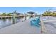 Relaxing dockside seating overlooking the waterway at 162 Croop Se Ln, Port Charlotte, FL 33952