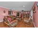 Gathering room with hardwood floors, wicker furniture, and bar at 162 Croop Se Ln, Port Charlotte, FL 33952