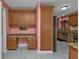 Built-in desk in kitchen with granite countertop at 162 Croop Se Ln, Port Charlotte, FL 33952