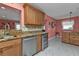 Kitchen features stainless steel appliances and wine cooler at 162 Croop Se Ln, Port Charlotte, FL 33952