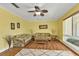 Living room boasts hardwood floors and ample natural light at 162 Croop Se Ln, Port Charlotte, FL 33952