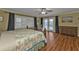 Main bedroom with king-size bed, built-in dresser and pool access at 162 Croop Se Ln, Port Charlotte, FL 33952