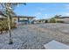 Outdoor patio with seating, grill, and lush landscaping at 162 Croop Se Ln, Port Charlotte, FL 33952