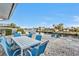 Waterfront patio with table and chairs for outdoor dining at 162 Croop Se Ln, Port Charlotte, FL 33952