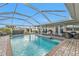 Enjoy this expansive pool and patio area, complete with a grill at 162 Croop Se Ln, Port Charlotte, FL 33952