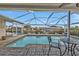 Inviting swimming pool with covered patio seating at 162 Croop Se Ln, Port Charlotte, FL 33952