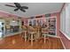 Home bar with built-in shelving and wicker barstools at 162 Croop Se Ln, Port Charlotte, FL 33952