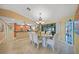 Dining area features chandelier lighting, seating for six, and easy kitchen access at 17143 Ohara Dr, Port Charlotte, FL 33948