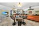 Bright kitchen area with an eat-in area, stainless steel appliances, and black countertops at 17143 Ohara Dr, Port Charlotte, FL 33948