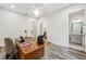 Home office with wood desk, adjacent to the bathroom at 17173 Bullhorn Cir, Punta Gorda, FL 33982