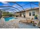 Large pool and patio with covered patio and lounge chair at 17173 Bullhorn Cir, Punta Gorda, FL 33982