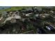 Aerial view of community clubhouse, parking, and landscaping at 17565 Opal Sand Dr # 201, Venice, FL 34293