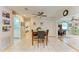 Bright dining area with table and chairs, view to kitchen and bathroom at 20352 Andover Ave, Port Charlotte, FL 33954