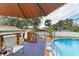 Relaxing pool deck with seating and a shaded area at 20352 Andover Ave, Port Charlotte, FL 33954