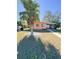 Pink house with palm tree, lawn, and walkway at 21061 Midway Blvd, Port Charlotte, FL 33952