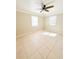 Large bedroom with tile floors and ample natural light at 21061 Midway Blvd, Port Charlotte, FL 33952