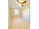 Bright bedroom with tile floors and double door closet at 21061 Midway Blvd, Port Charlotte, FL 33952