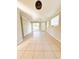 Bright living room with tile floors and sliding glass doors at 21061 Midway Blvd, Port Charlotte, FL 33952