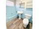 Bathroom with light blue tile and updated vanity at 21061 Midway Blvd, Port Charlotte, FL 33952