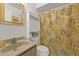 Bathroom with shower/tub combo, vanity, and patterned shower curtain at 25225 Rampart Blvd # 1606, Punta Gorda, FL 33983