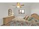 Bedroom with double bed, dresser, and ceiling fan at 25225 Rampart Blvd # 1606, Punta Gorda, FL 33983