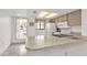 Cozy kitchen with light countertops and appliances at 25225 Rampart Blvd # 1606, Punta Gorda, FL 33983