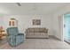 Bright living room with tiled floors, comfy seating, and sliding glass doors at 25225 Rampart Blvd # 1606, Punta Gorda, FL 33983