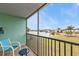 Enjoy serene lake views from this screened balcony with comfortable seating at 25225 Rampart Blvd # 1606, Punta Gorda, FL 33983