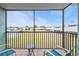 Relaxing screened balcony overlooking a tranquil lake and lush landscape at 25225 Rampart Blvd # 1606, Punta Gorda, FL 33983